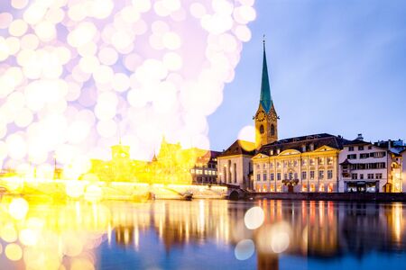 christmas lights and snow in  Zurich city center with famous Fraumunster and Grossmunster Churches and river Limmat at Lake Zurich, Canton of Zurich, Switzerlandの写真素材