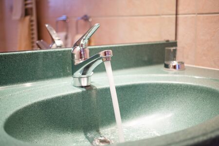 running tap water in bathroom