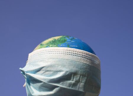 coronavirus world alert - surgical mask on globe