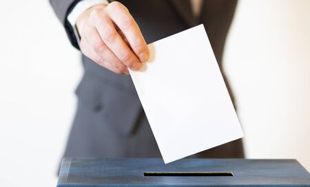 elections  hand  putting  vote in the ballot box
