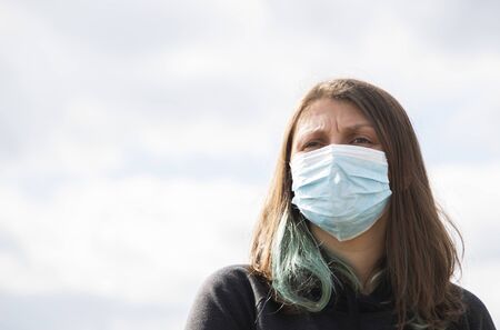 coronavirus global fight concept - COVID-19 - woman wearing surgical mask