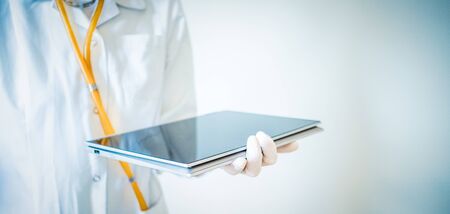 doctor working on tablet medical careの写真素材