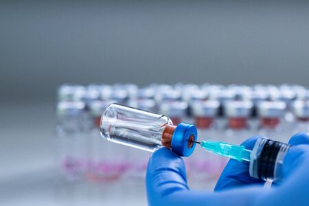 close up on vaccine and medical syringeの写真素材