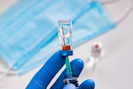 close up on vaccine and medical syringeの写真素材