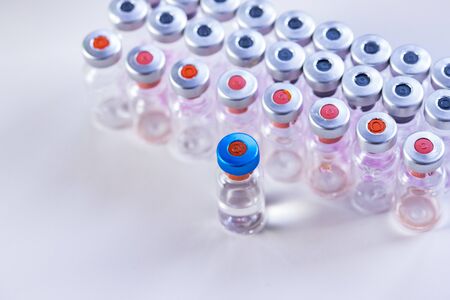 close up on vaccine and medical syringe