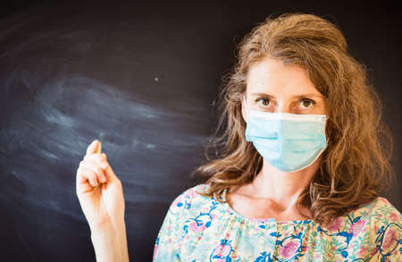 teacher wearing face mask back to school during covid pandemicsの写真素材