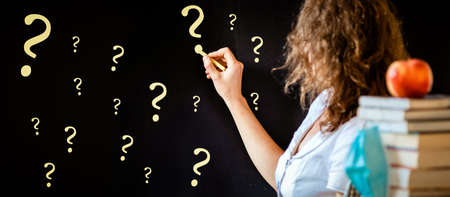 back to school during covid pandemic pile of books and medical maskの写真素材