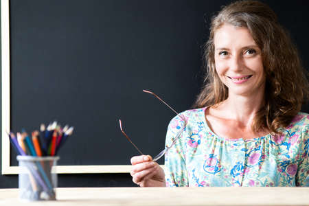 teacher welcoming students back to schoolの写真素材