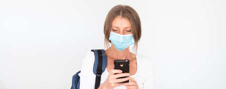 woman with mask laptop and notebooksの写真素材