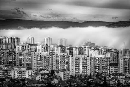 blocks of flats in fog suburban area