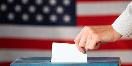elections in the US - voting ballot and American flagの写真素材