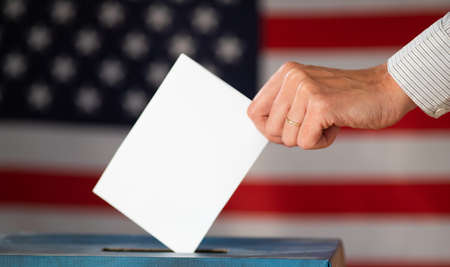 elections in the US - voting ballot and American flagの写真素材