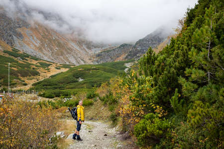 woman trekking in high mountains social distancingの写真素材