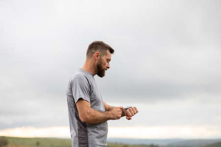 runner checking his smart watchの写真素材