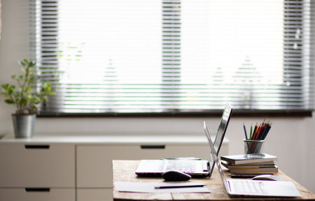 home office laptops on vintage wooden tableの写真素材