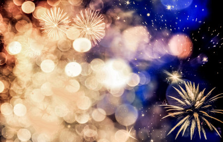 abstract Christmas or New Year background with lights and fireworksの写真素材