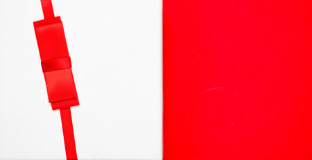 top view of rwhite gift box  on red and ribbonの写真素材