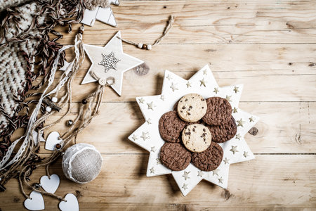 top view of beige and green Christmas decorations cozy home hygge