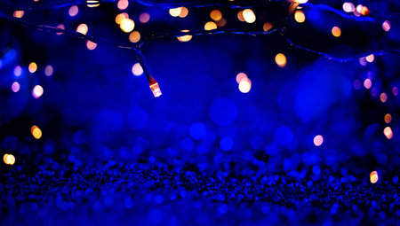 abstract blue glitter lights background defocusedの写真素材