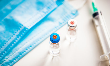 close up on vaccine and medical syringeの写真素材