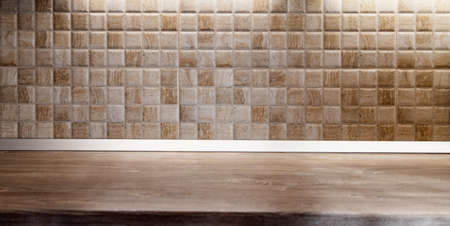 wooden desk space and tiles home background with copy space