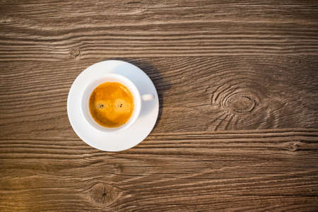 cup of coffee on wooden backgroundの写真素材
