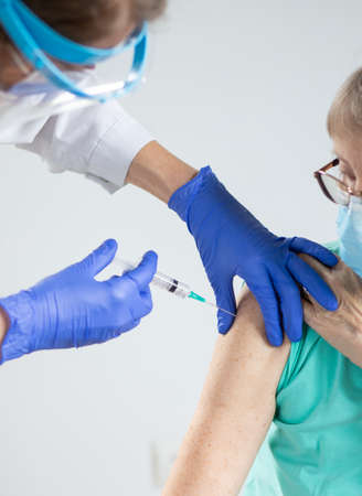 elderly woman getting vaccineの写真素材