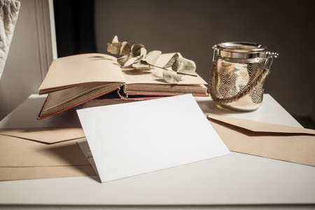 blank greeting card  invitation mockup with craft paper envelope  feminine still life composition