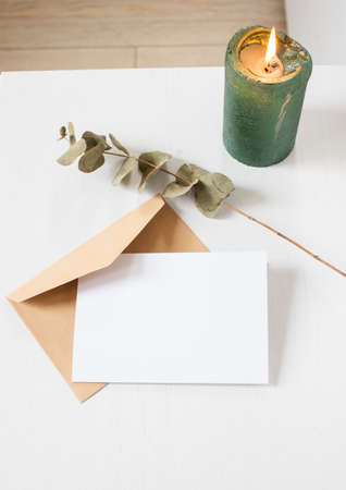 blank greeting card  invitation mockup with craft paper envelope  feminine still life compositionの写真素材
