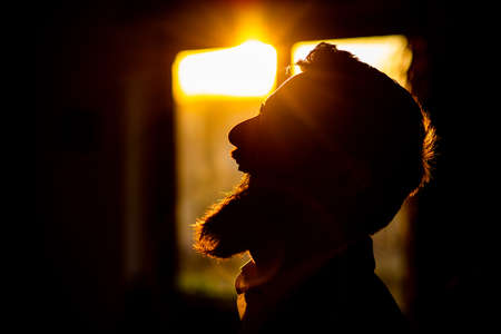 bearded man laughing in sunset happinessの写真素材