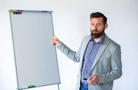teacher with empty whiteboard copyspaceの写真素材