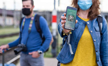 health Vaccine Passport for Coronavirus or Covid-19. Traveller Using Mobile Phone with Vaccination...