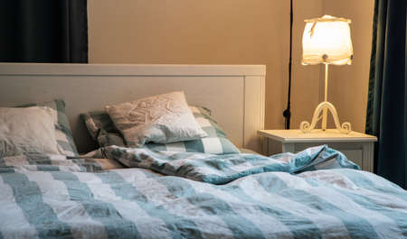 cozy bedroom detail with night lampの写真素材