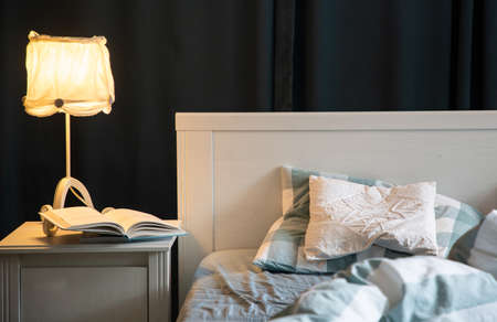 cozy bedroom detail with night lampの写真素材