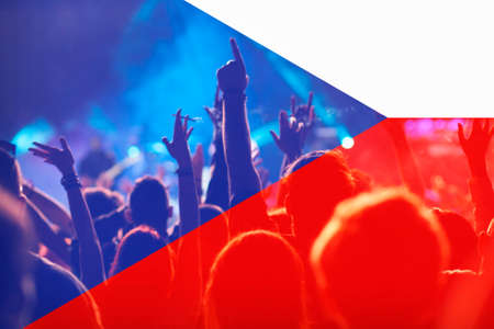 football fans supporting Czech Republic - crowd celebrating in stadium with raised hands against...
