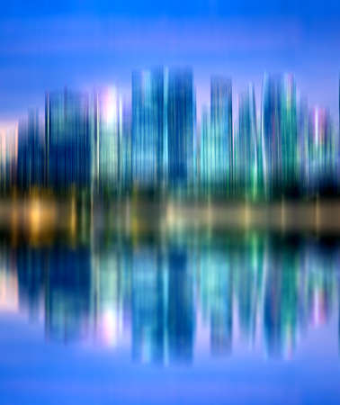 abstract background of blurred skyscrapers at night business and technology conceptの写真素材