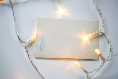 christmas lights on an empty notebook pageの写真素材