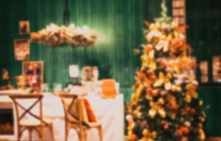 blurred background of Christmas tree in home interiorの写真素材