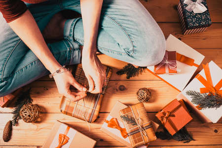 woman wrapping christmas presentsの写真素材