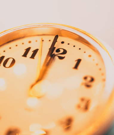 new Year's at midnight - clock at twelve o'clock with holiday lights