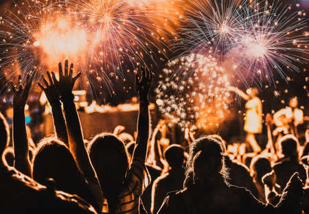 Cheering crowd watching fireworks at New Yearの写真素材