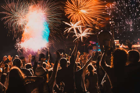 cheering crowd and fireworks - New Year celebration conceptの写真素材