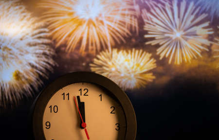 clock at midnight and fireworks  New Year's eve celebrationの写真素材