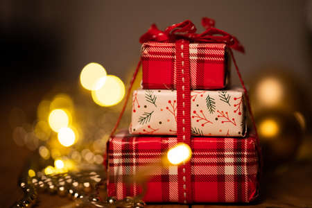 red gift boxes and holiday Christmas lights