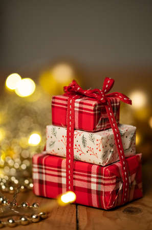 red gift boxes and holiday Christmas lightsの写真素材