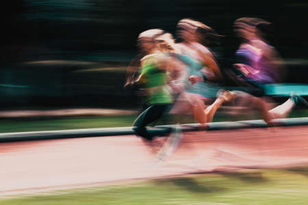blurred image of runners in a competitionの写真素材