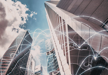 skyscrapers and connection lines. Wireless network and Connection technology concept with city backgroundの写真素材