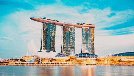 SINGAPORE, SINGAPORE - MARCH 2019: Skyline of Singapore Marina Bay at night with Marina Bay sands, Art Science museum , skyscrapers and tourist boatsのeditorial素材