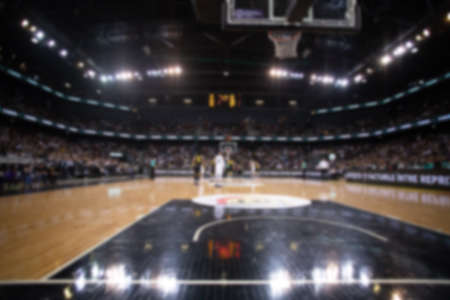 blurred background of supporters at sports event crowd of people in a basketball courtの写真素材