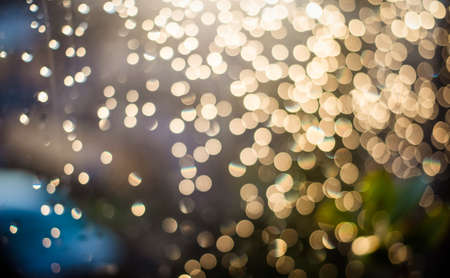 sparkling glittering golden bokeh backgroundの写真素材